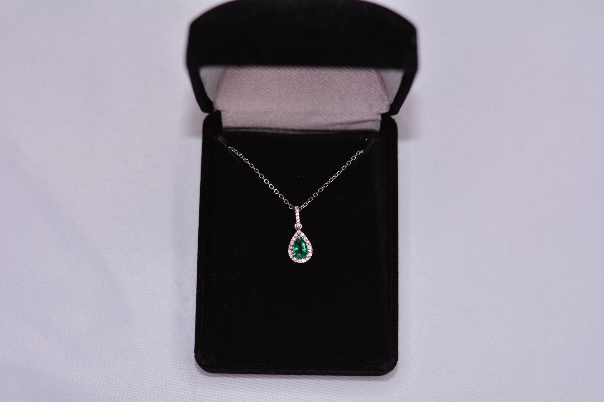 14KT White Gold Pear Emerald Pendant with Diamond Halo